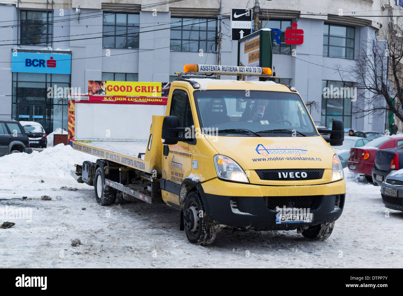 Romanian yellow tow truck in Bucharest, Romania Stock Photo