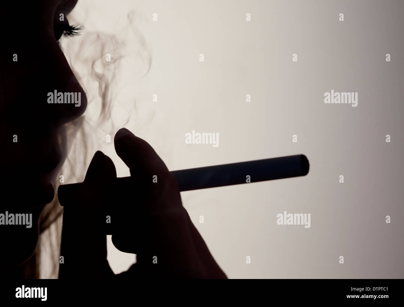 Young teenage girl smoking e or electronic cigarette, image is ...