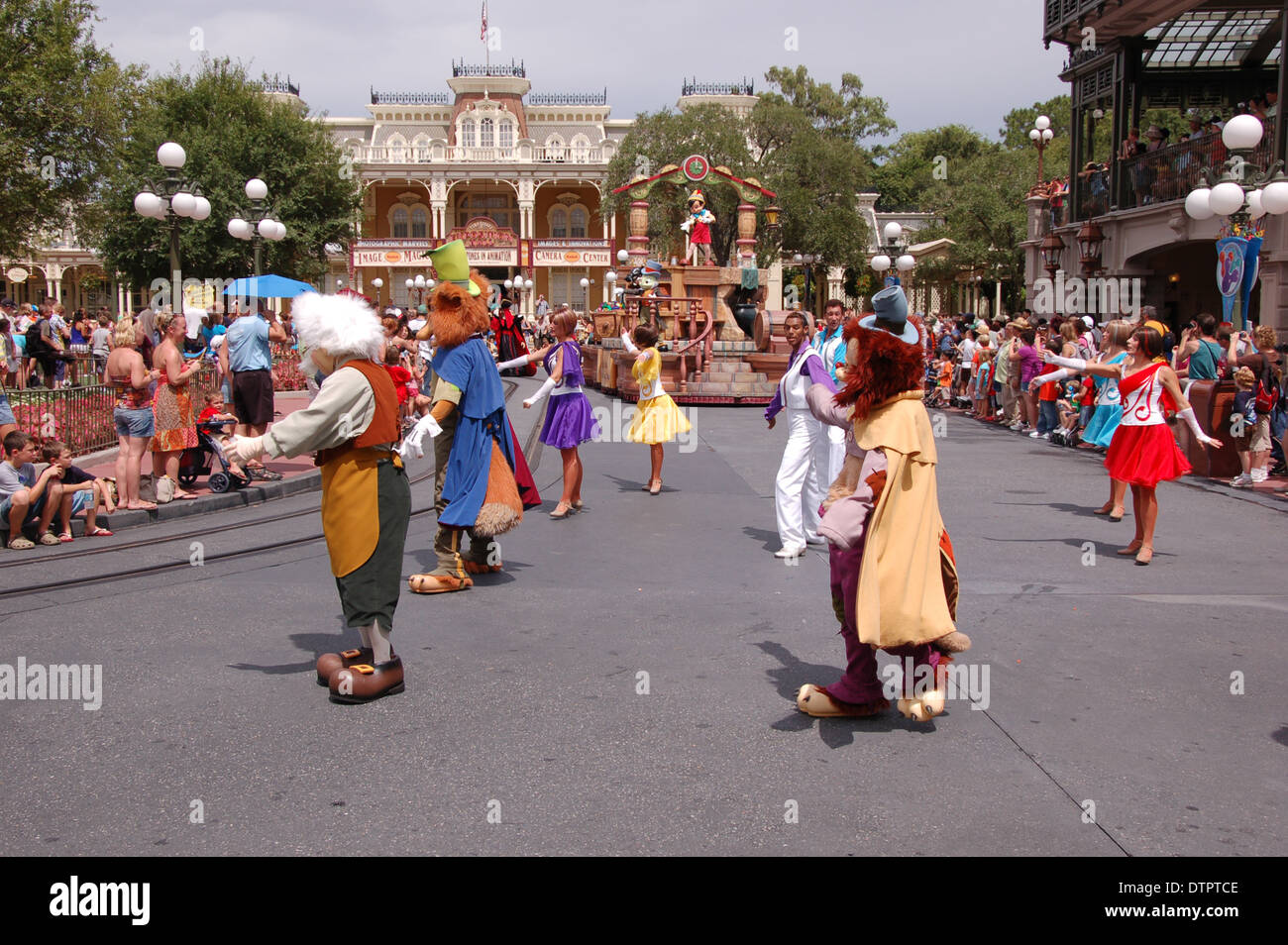 Performers in costume dancing on the streets celebrating A Dream Come True parade at Disney's Magic Kingdom, Walt Disney World, Orlando, U.S.A Stock Photo