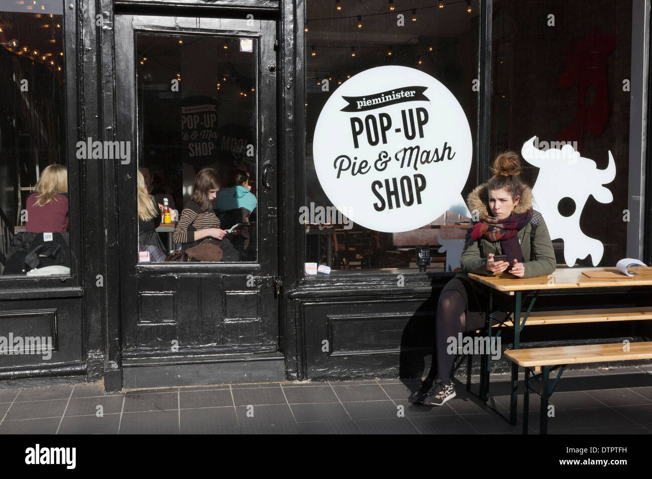 Customers at a popup Pie & Mash shop in Chalk Farm Road, Camden