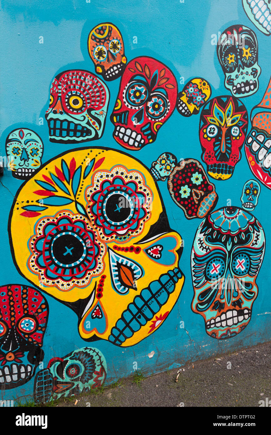 Colourful skull graffiti on a wall in Camden Town by Faye Suzannah and Helen Wheels, London, England, United Kingdom, UK Stock Photo
