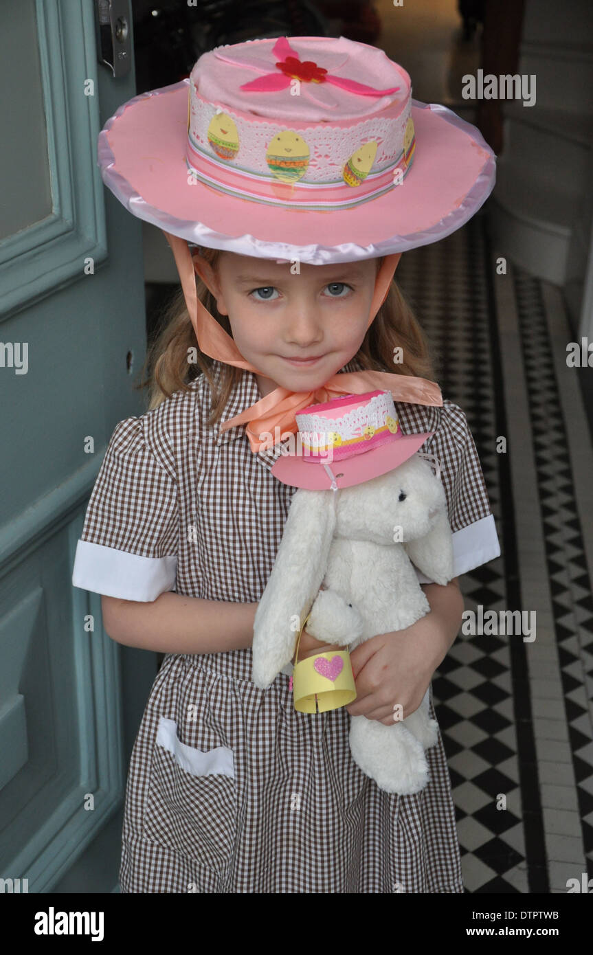 Easter picture of cute little girl wearing an easter and holding