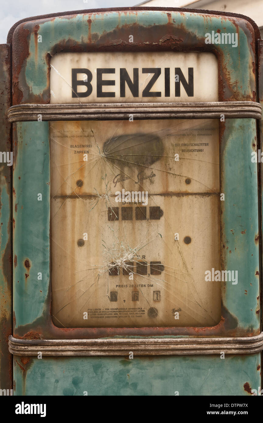 Old fashioned petrol diesel benzine fuel pump dispenser retro design left  abandoned on old disused garage forecourt Stock Photo - Alamy