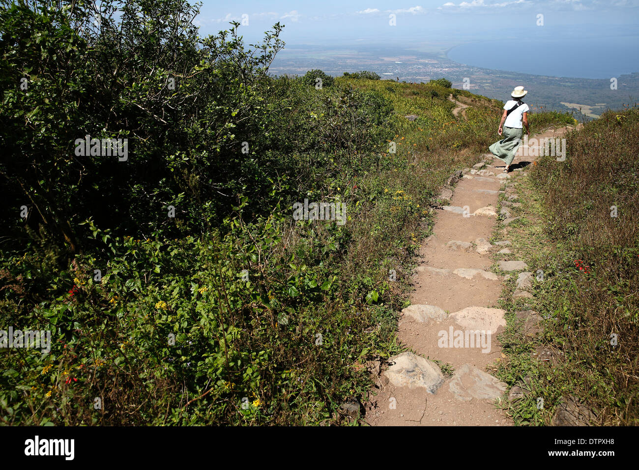 Woman walking path on Mombacho Volcano, Nicaragua Stock Photo
