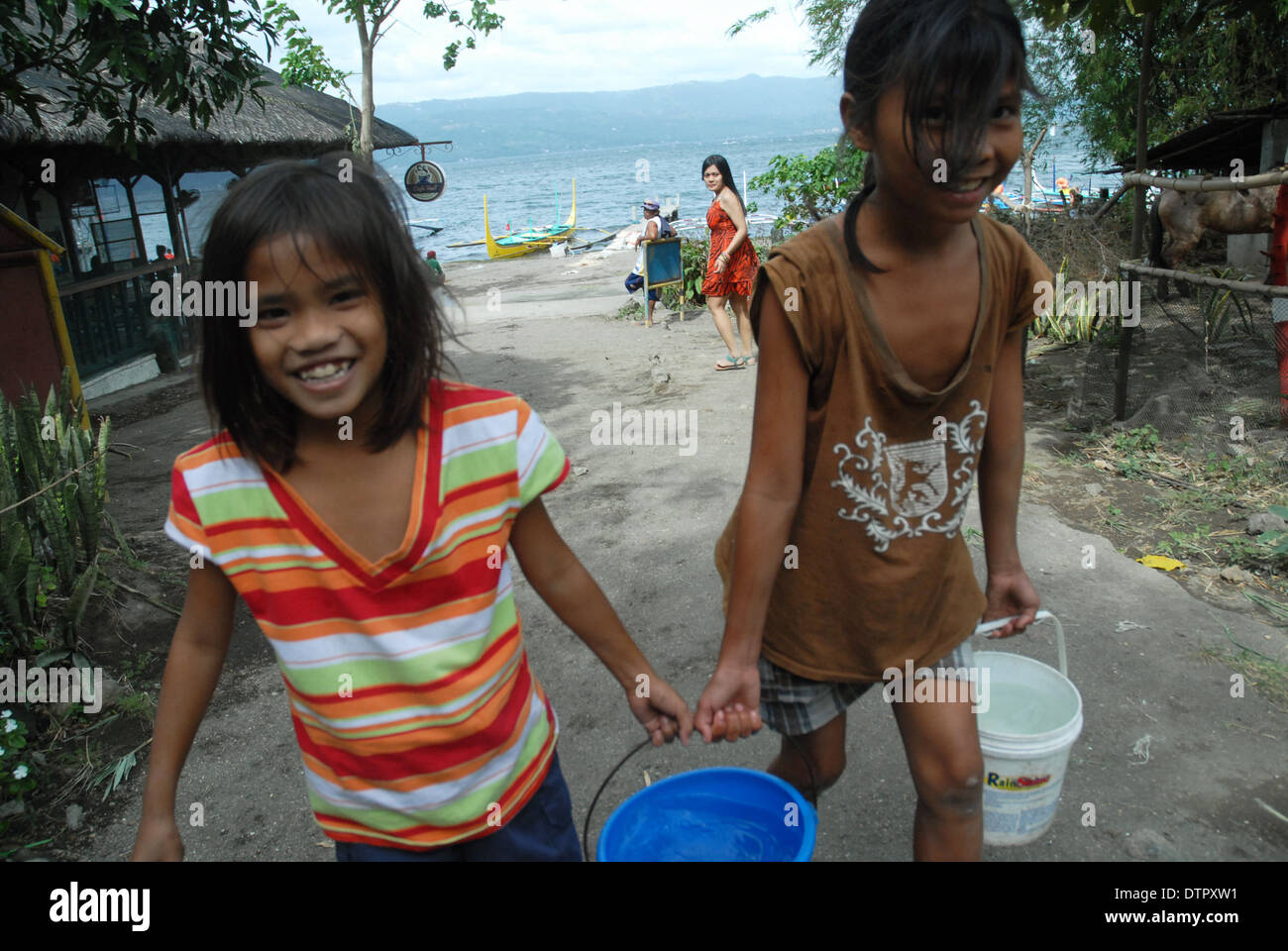 Girls Carrying Water Taal Volcano Luzon Philippines Asia Stock