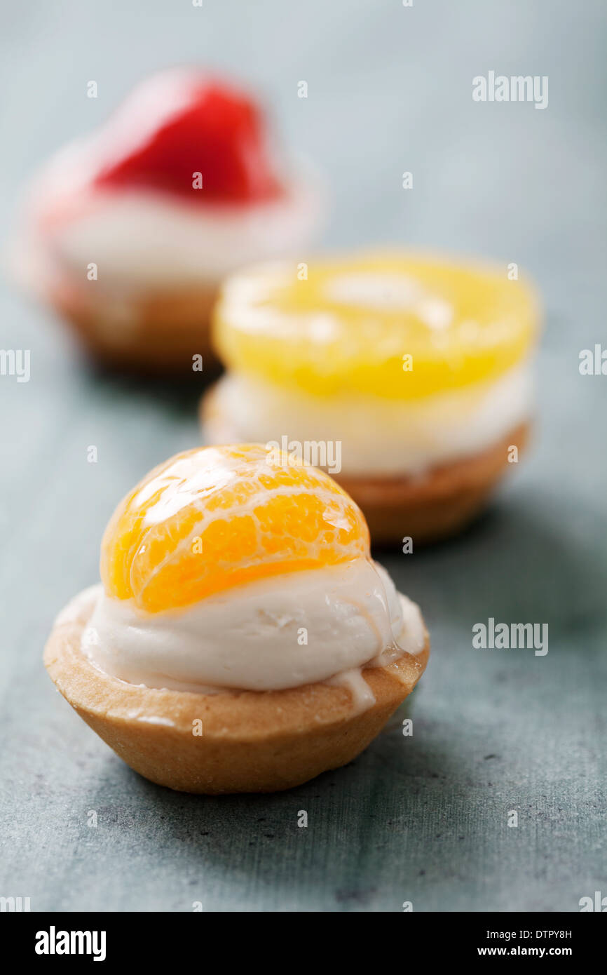 mini tarts with cream and fruit Stock Photo