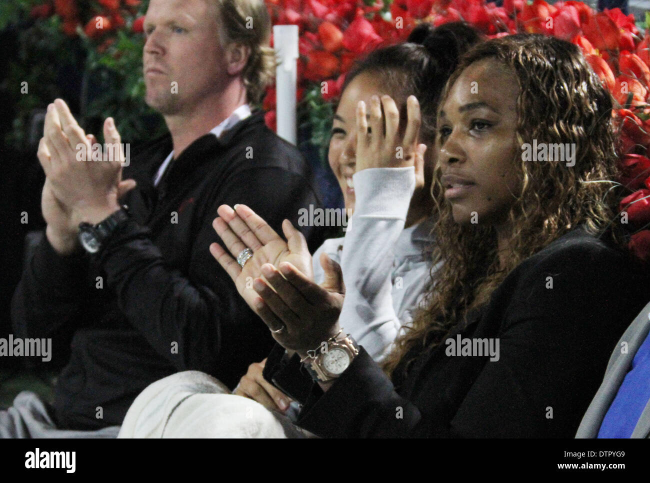 Dubai, United Arab Emirates. 22nd Feb, 2014. Serena Williams (R) claps