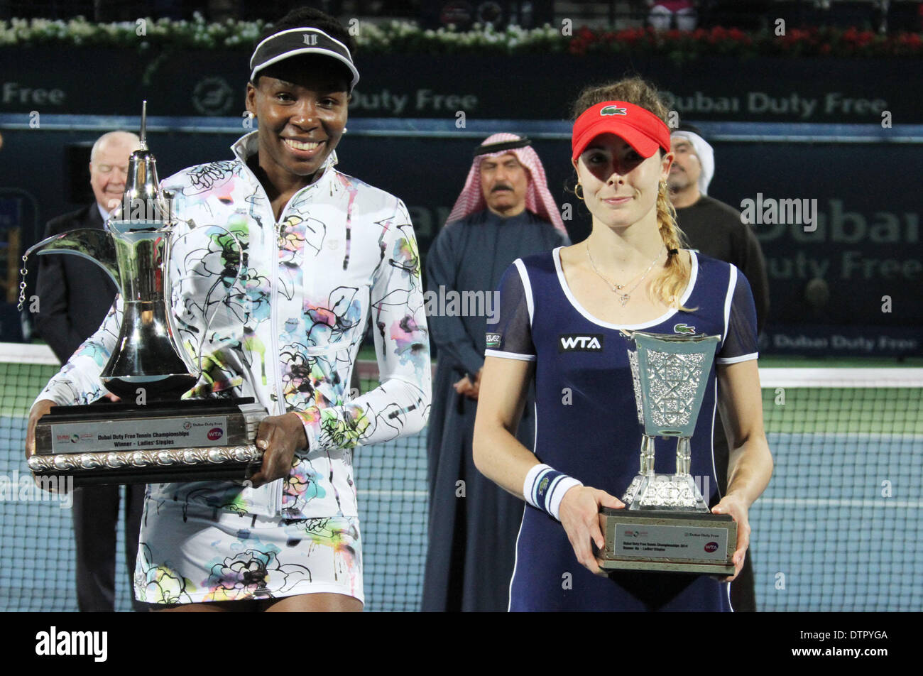 Dubai, United Arab Emirates. 22nd Feb, 2014. Venus Williams (L) of the United States and Alize Cornet of France pose for photograph during the awarding ceremony of their final match at the Dubai Tennis Championships in Dubai, United Arab Emirates, Feb. 22, 2014. Venus Williams won 2-0 to claim the champion. Credit:  Li Zhen/Xinhua/Alamy Live News Stock Photo