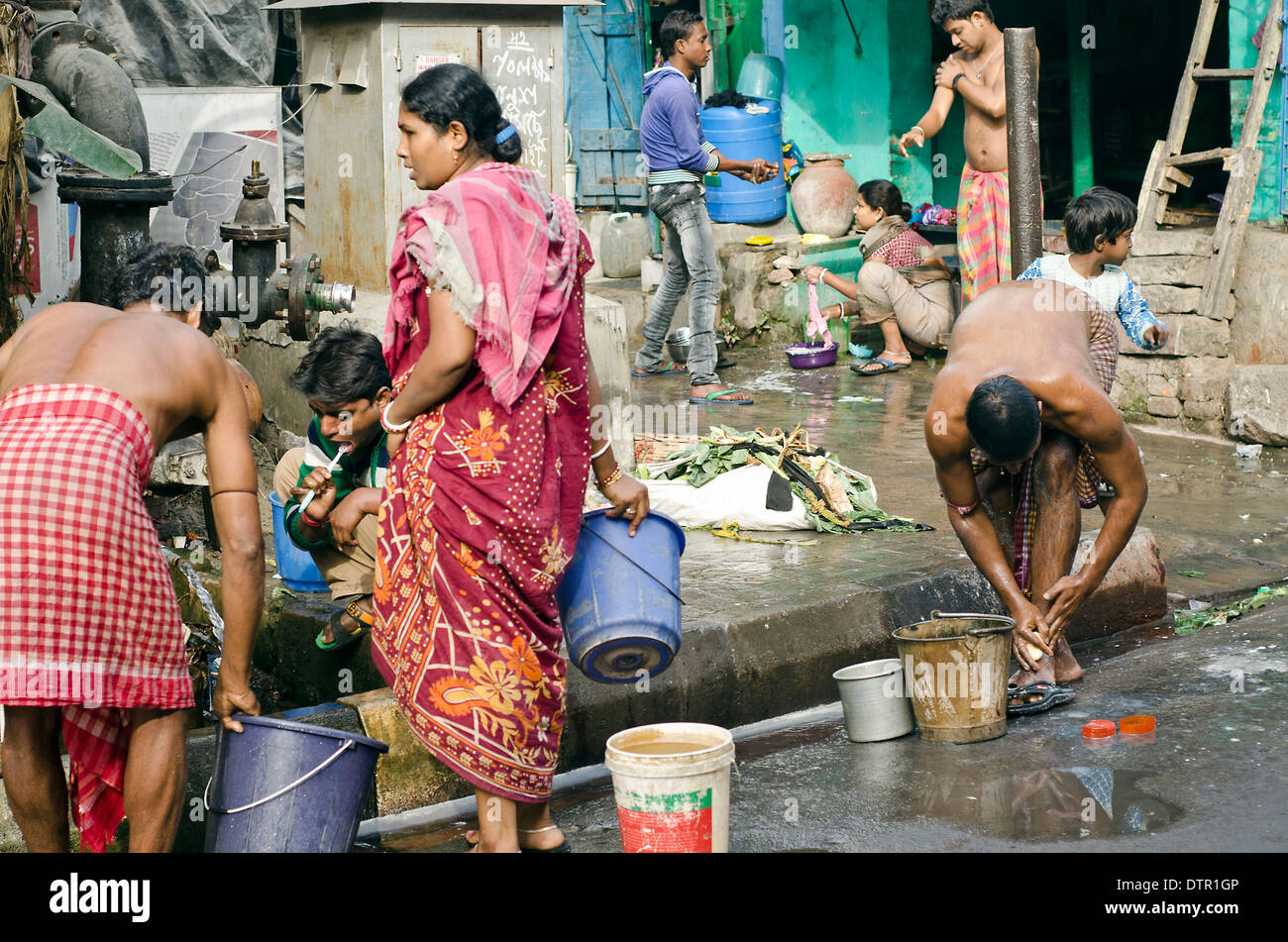 People washing on the street of Kolkata Stock Photo