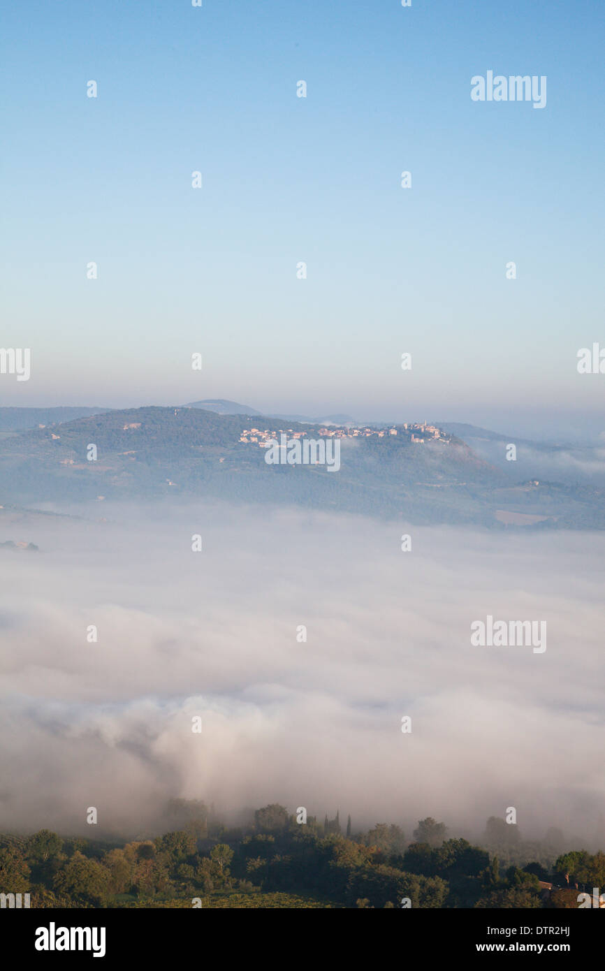 Morning mist on the slopes of Montepulciano, Tuscany, Italy. Mandatory credit Jo Whitworth Stock Photo