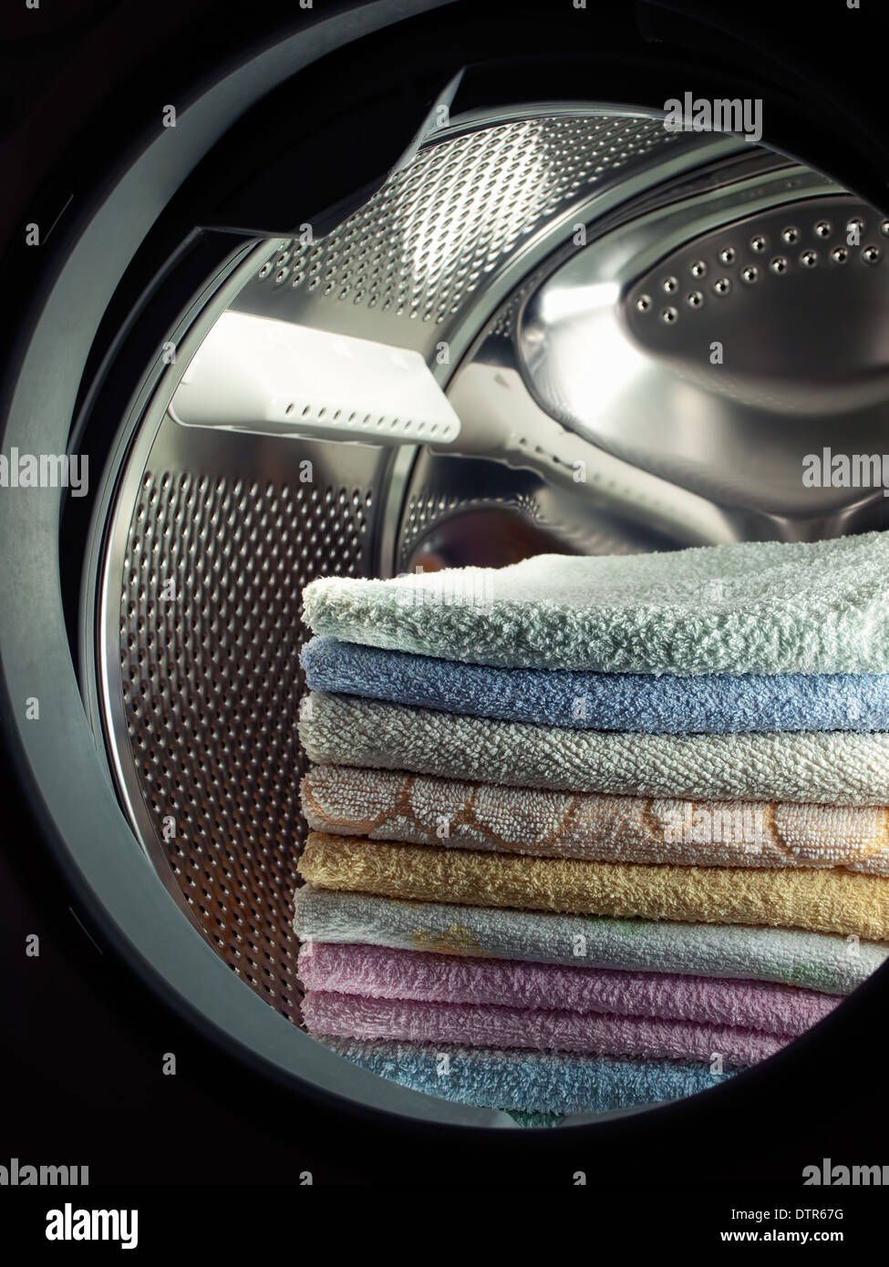 Stacked clean towels in the washing machine Stock Photo Alamy