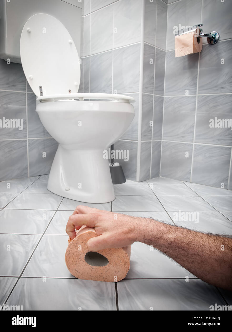Concept image of digestive problems and difficulties in the toilet. Stock Photo