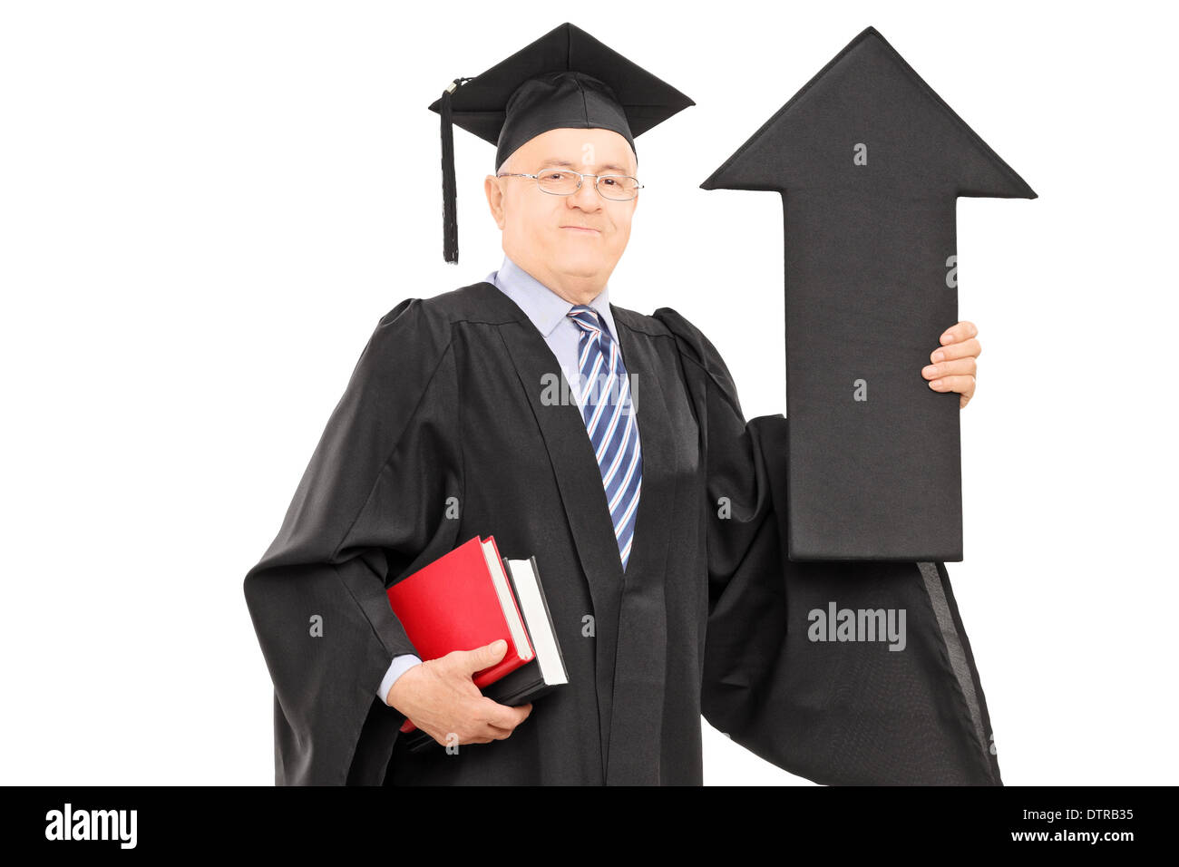 Mature man in graduation gown holding big black arrow pointing up Stock ...