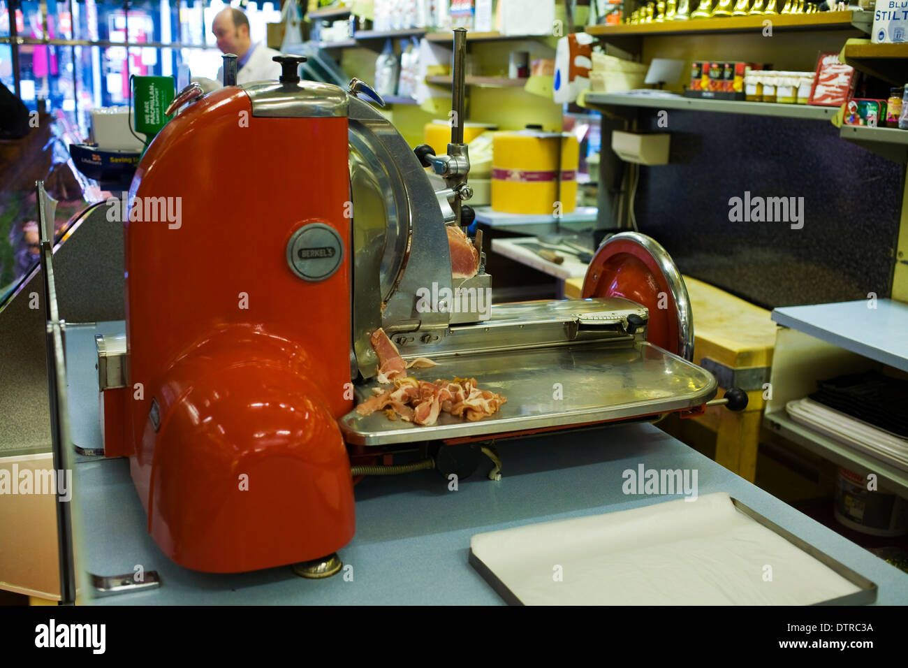 Meat Slicer in Traditional Butchers Stock Photo