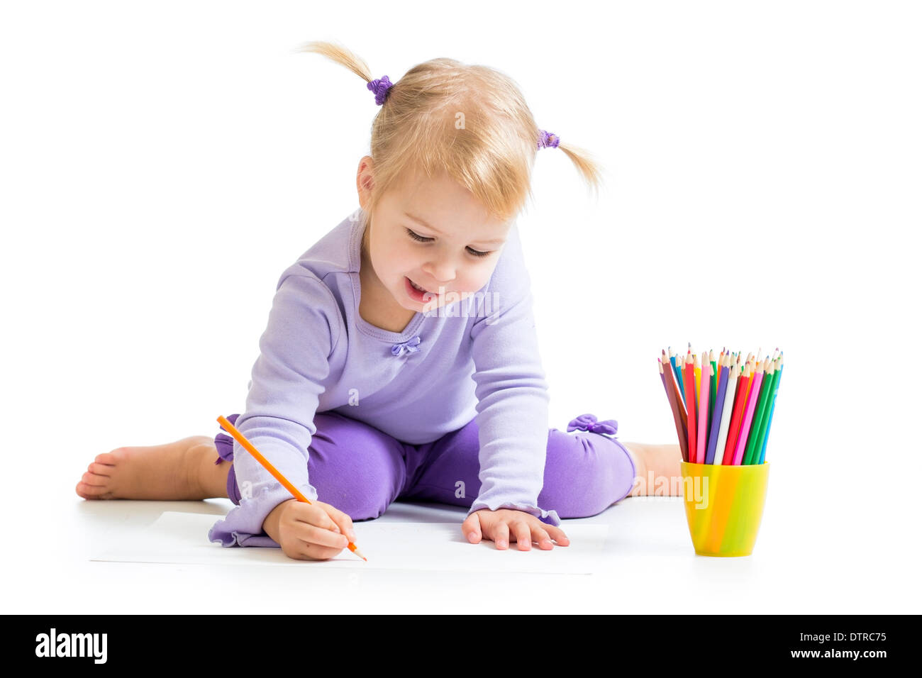 cute girl drawing with colourful pencils Stock Photo