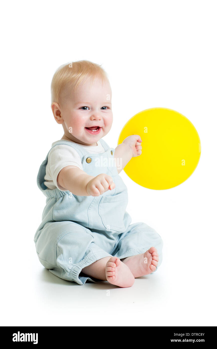 Happy baby boy with yellow ballon isolated on white Stock Photo