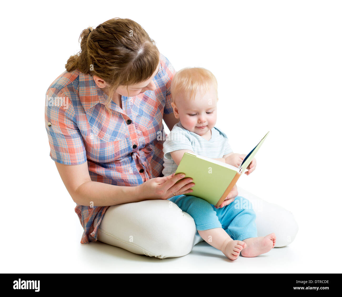 mother reading a book to her baby boy Stock Photo