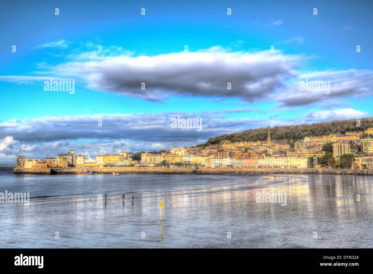 Weston-super-Mare beach and seafront Somerset England blue sky and clouds in HDR view from pier towards Knightstone Stock Photo