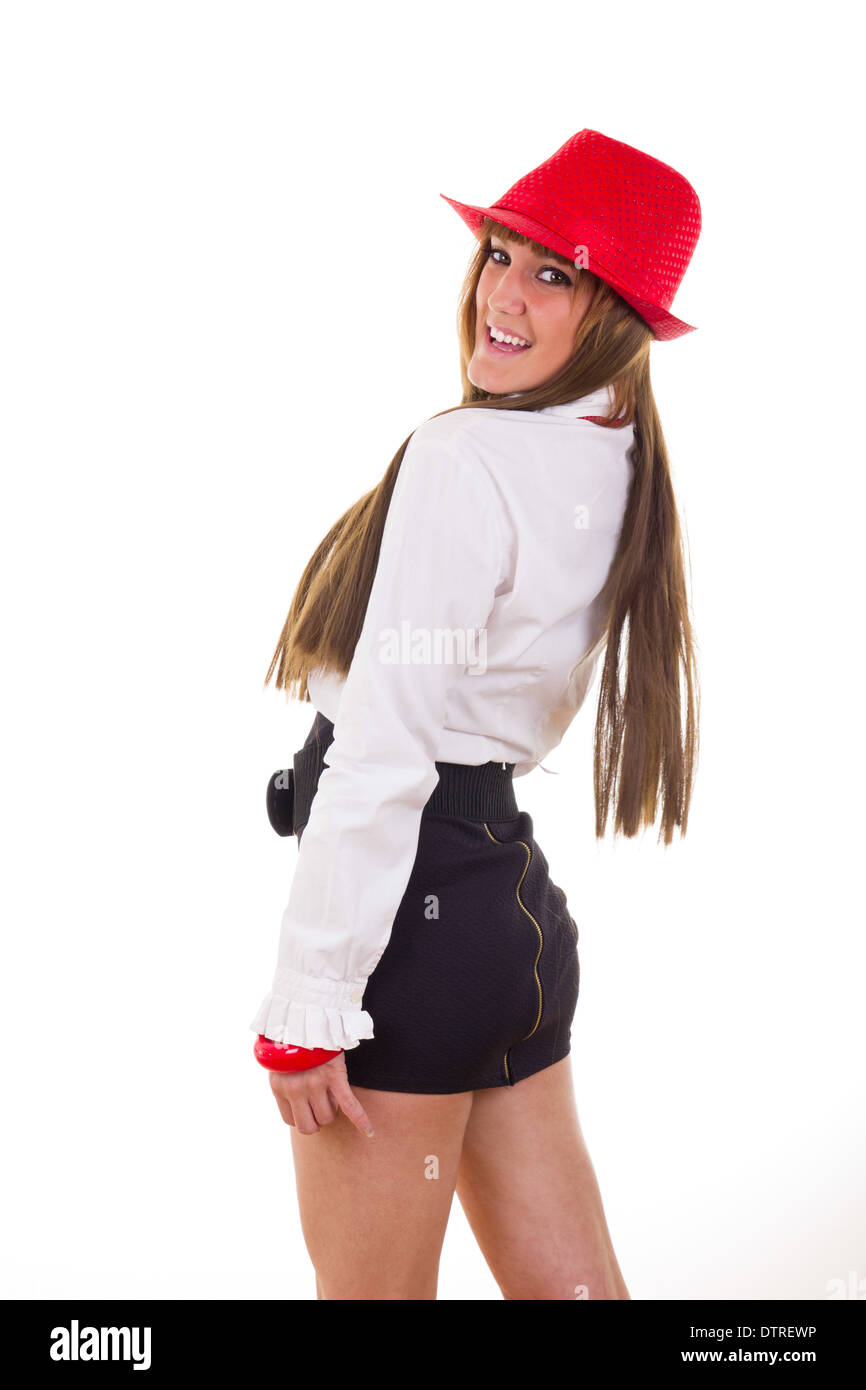 modern smiling young woman in skirt and shirt wearing red hat and