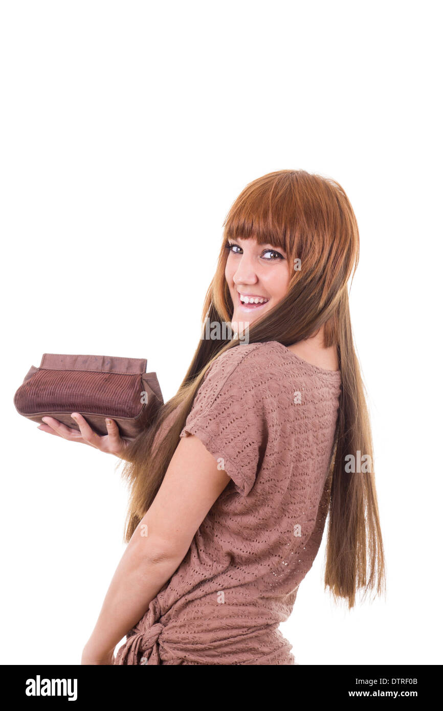 pretty smiling girl in brown dress holding vanity case Stock Photo