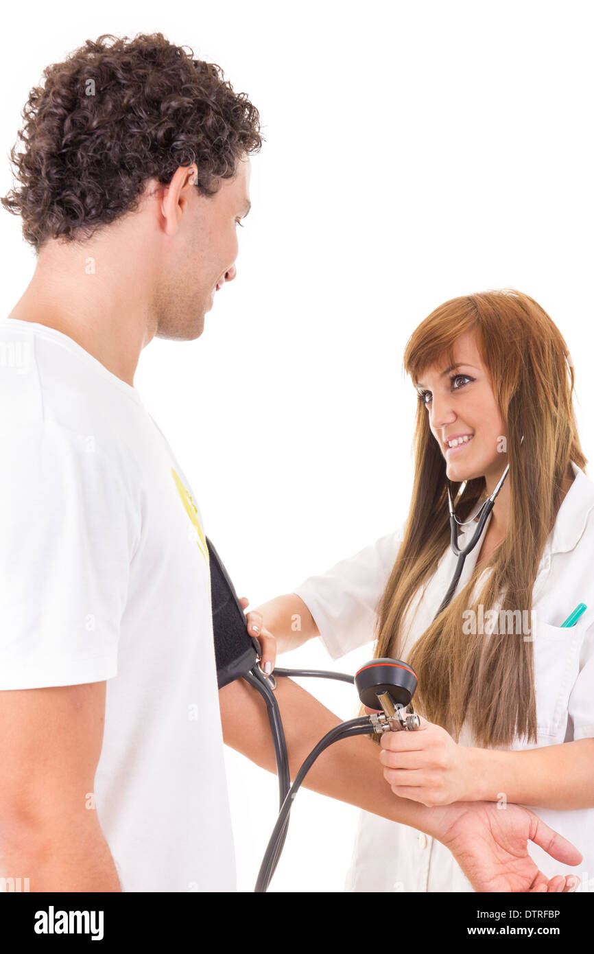 smiling professional nurse or doctor measures the blood pressure of a satisfied patient Stock Photo