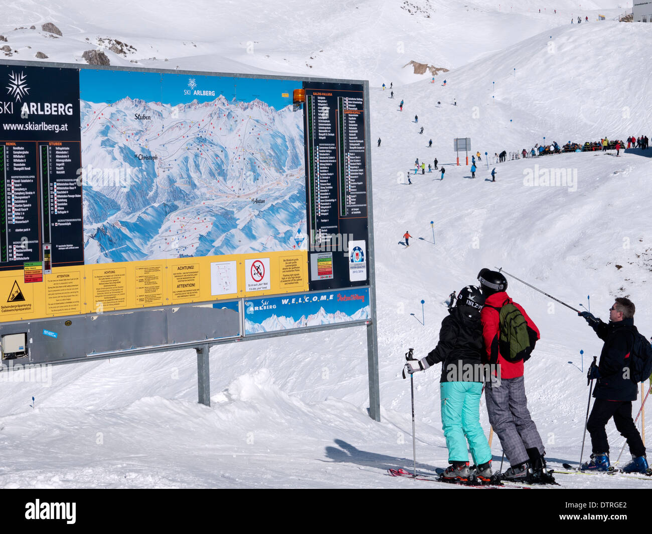 Skiers checking the piste map notice board at St Anton in Austria Stock Photo