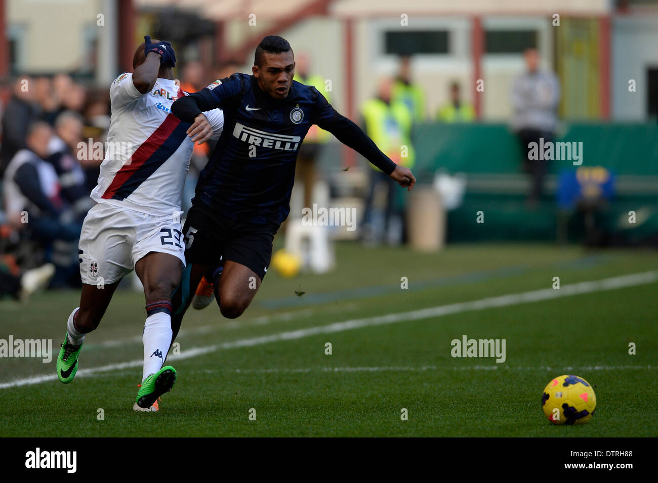 Milan, Italy. 23rd Feb, 2014. Juan Jesus of Inter Milan and Victor Ibarbo of Cagliari in action during the Serie A match between Inter Milan and Cagliari at San Siro Stadium. Credit:  Action Plus Sports/Alamy Live News Stock Photo