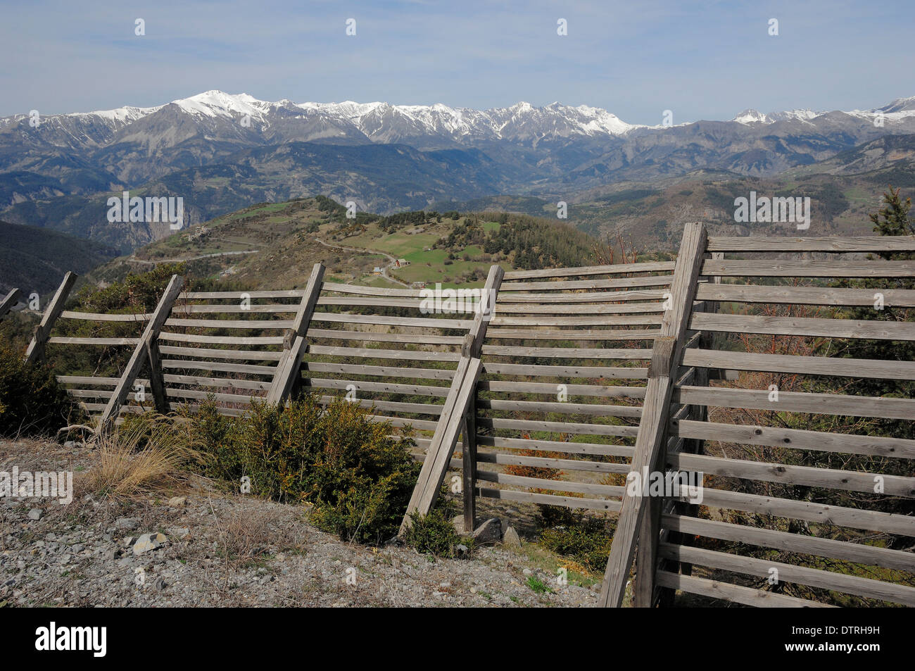 Snow protection fence and french alpes, Alpes-Maritimes, Provence-Alpes-Cote d'Azur, Southern France Stock Photo