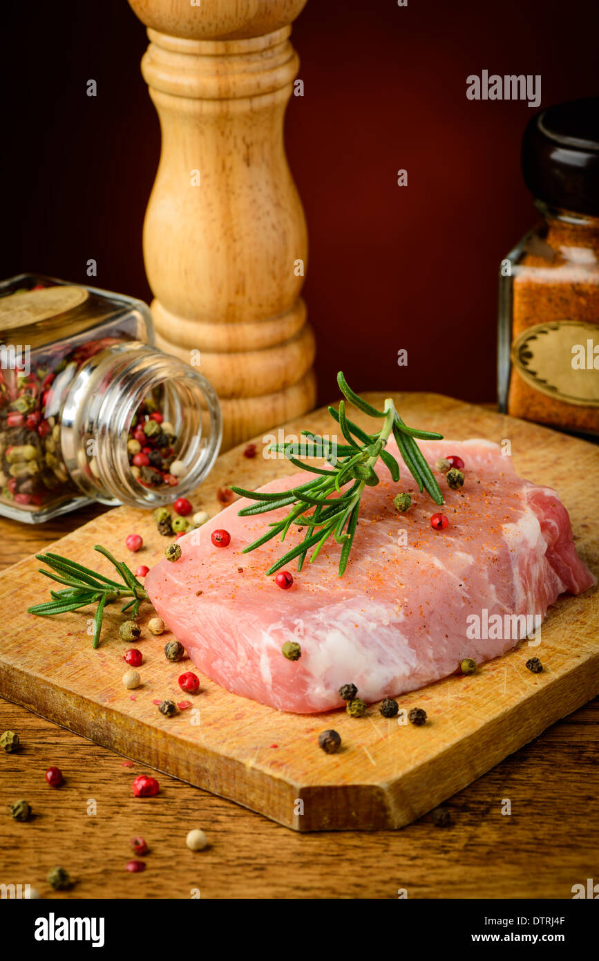 still life with raw pork meat and seasoning Stock Photo
