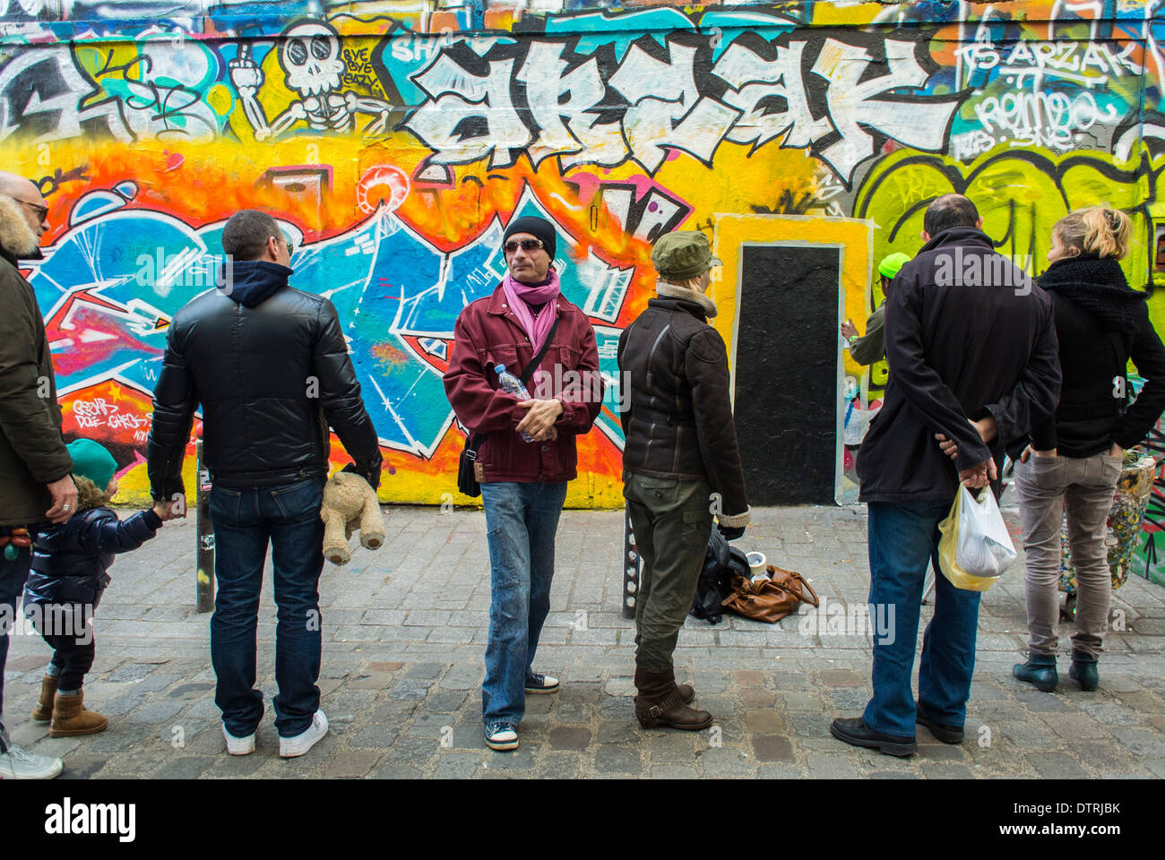 Paris, France., People Looking at French Wall Art, Street Scene, Graffitti Illustration, in Belleville Area Stock Photo