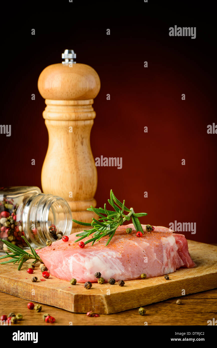 still life with raw steak, herbs and spices Stock Photo