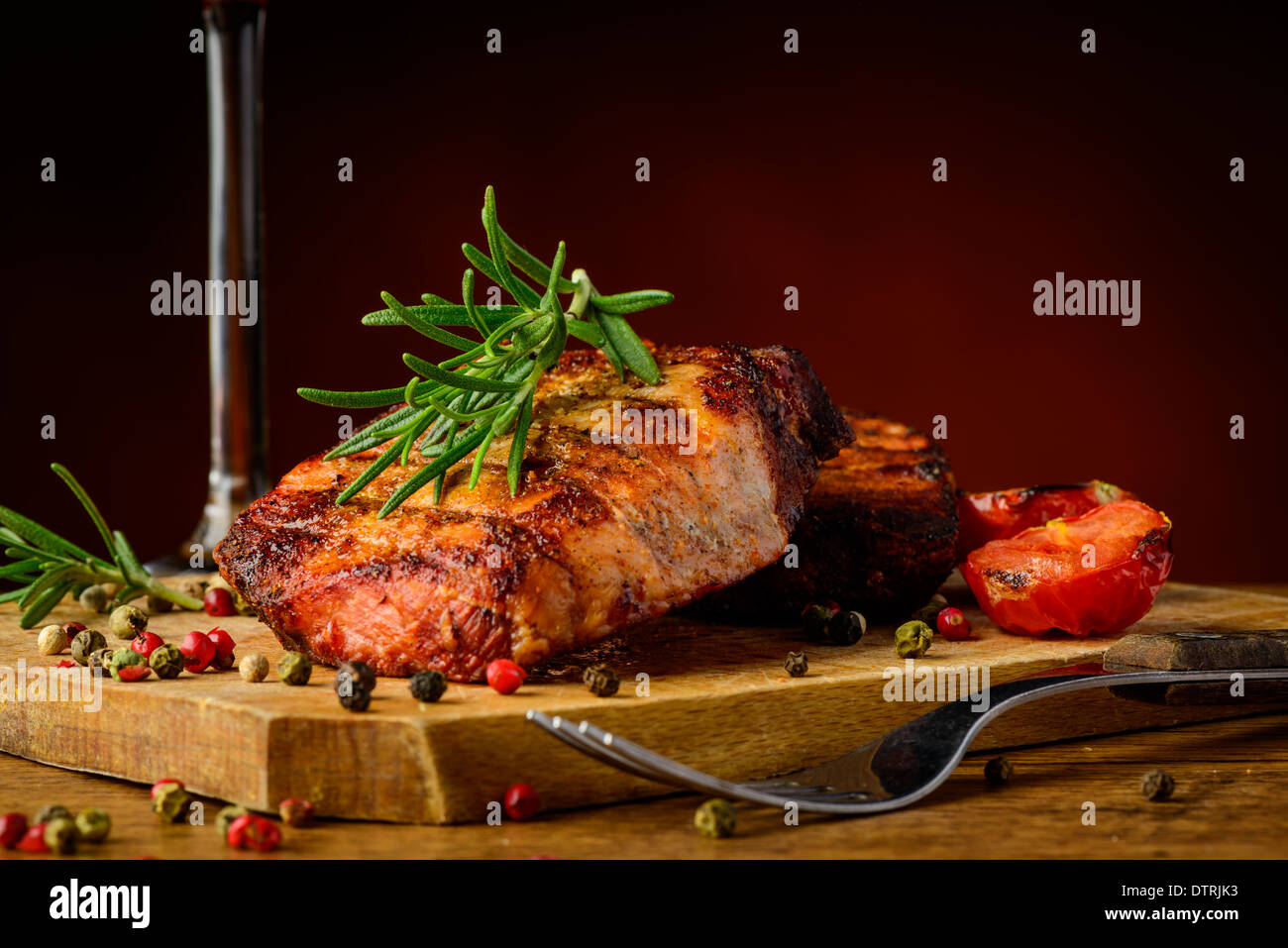 still life with grilled steak meal, herbs and spices Stock Photo