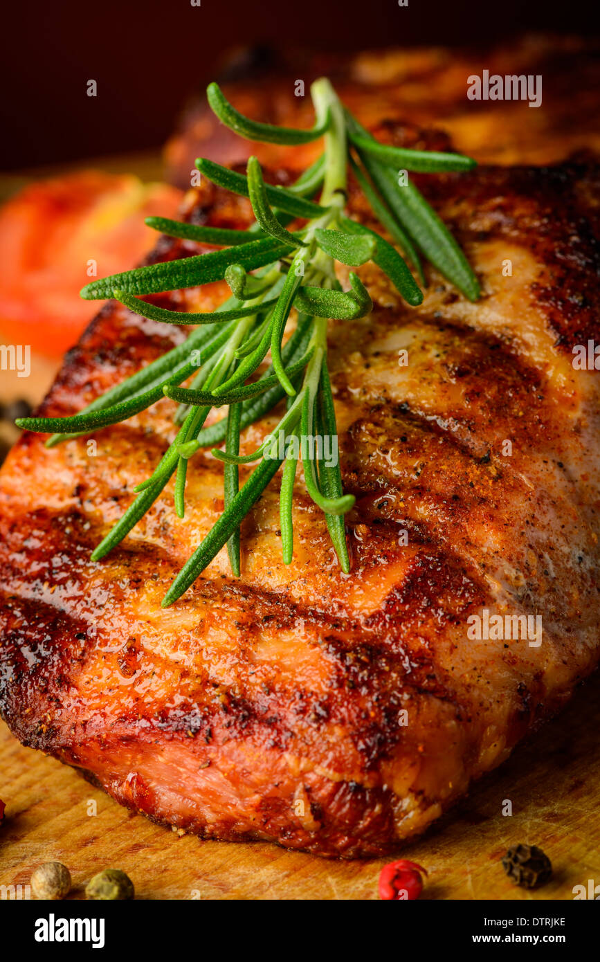 still life with grilled beef steak and rosemary herb Stock Photo