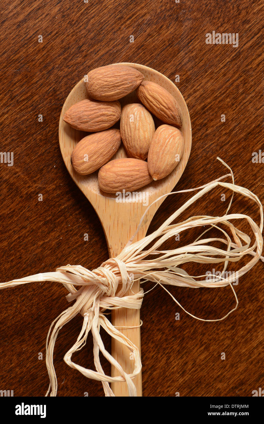 Almonds on Wooden Spoon Stock Photo