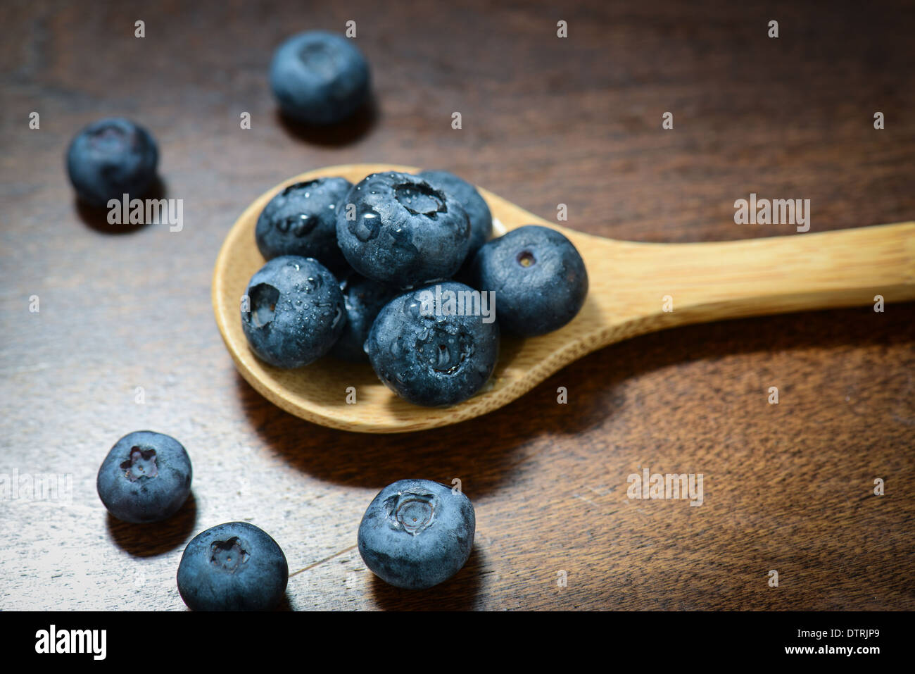 Blueberries on a Wooden Spoon Stock Photo