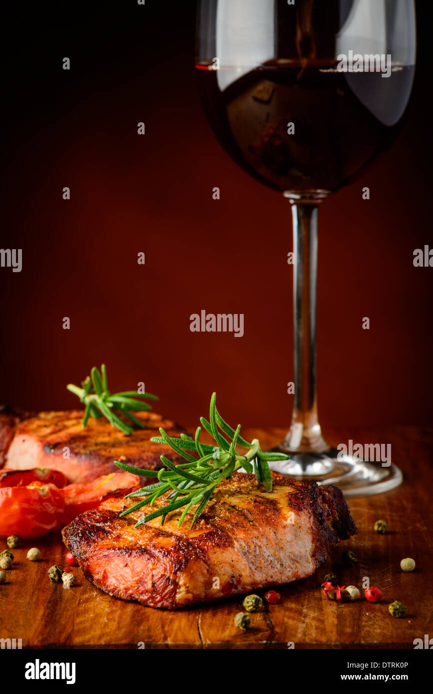 still life with grilled meat and glass of red wine Stock Photo