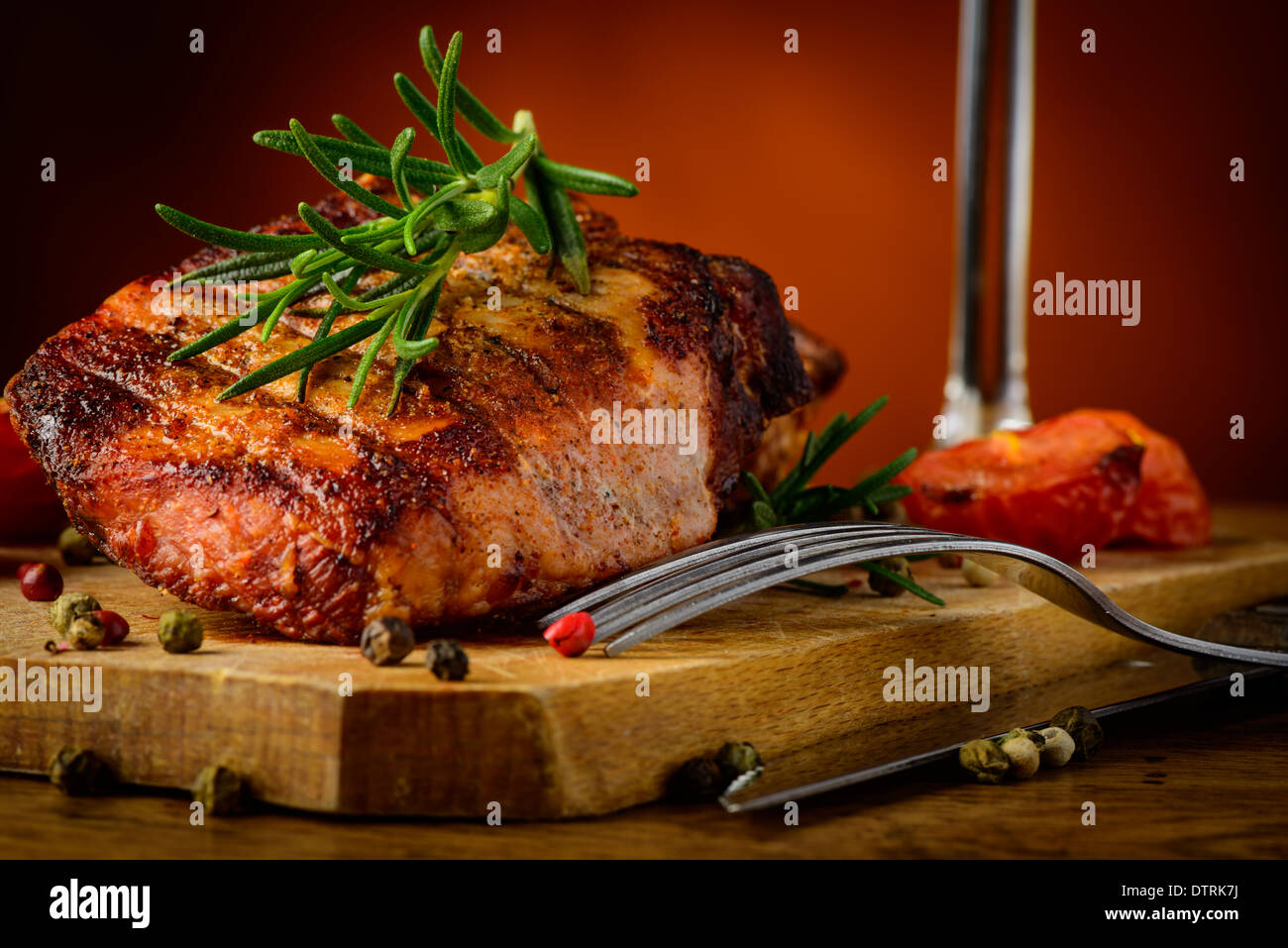 still life with grilled steak closeup detail and rosemary Stock Photo