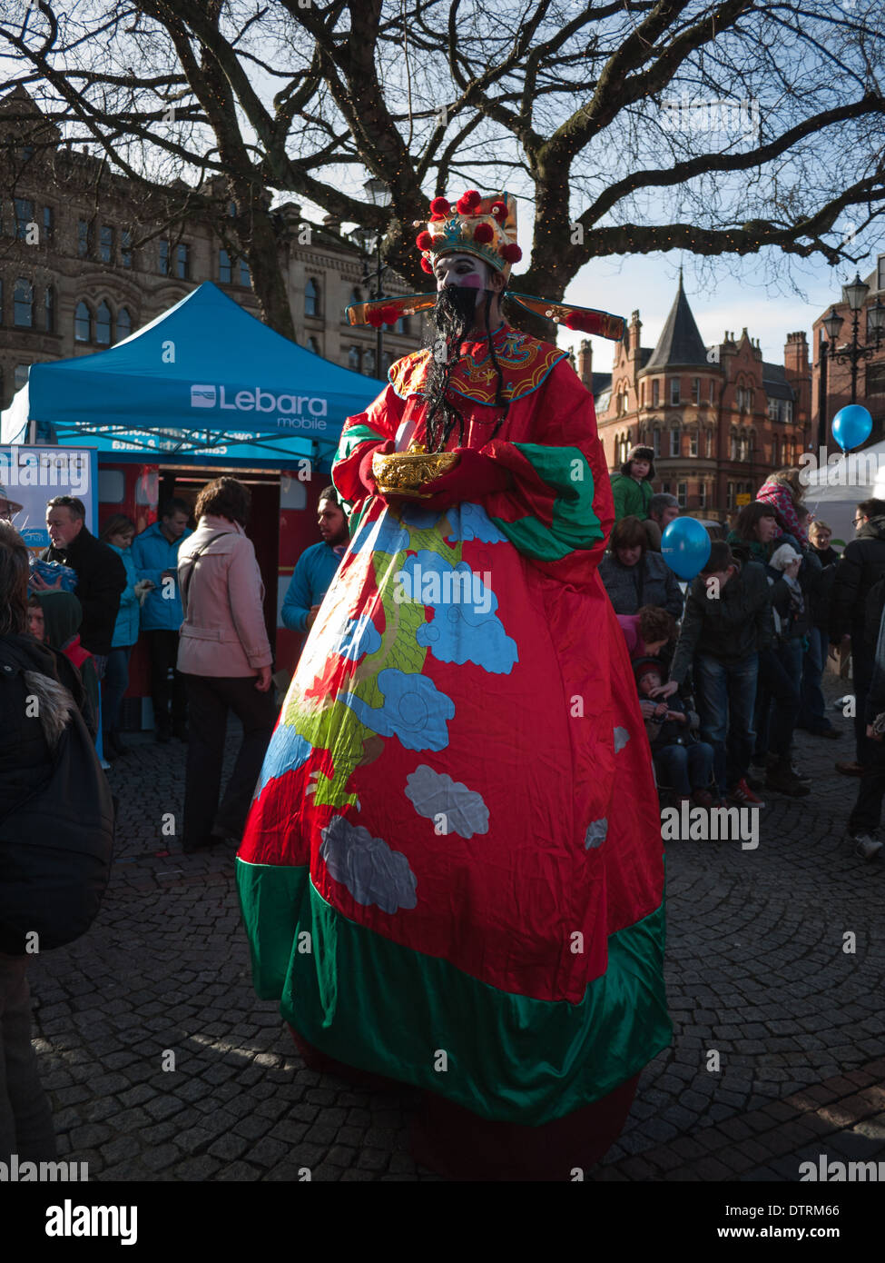 Man in Oriental costume at Chinese New Year, Albert Square, Manchester Stock Photo
