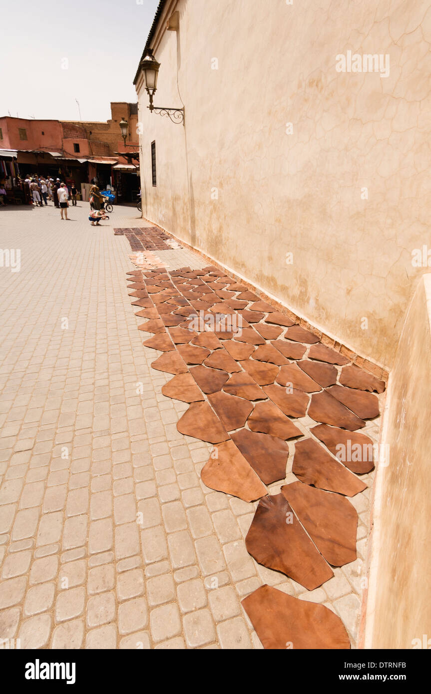 Treated leather drying in the sun in Place de La Kissariat Ben Youssef in Marrakesh, Morocco. Stock Photo