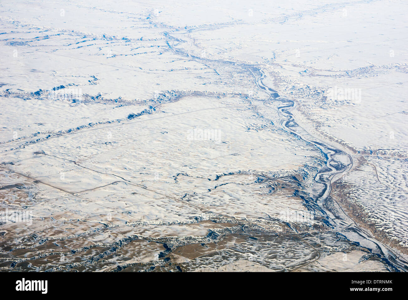 Dendritic river drainage pattern in prairie landscape, aerial view of the snow covered Red Deer River and tributaries, Drumheller, Alberta, Canada Stock Photo