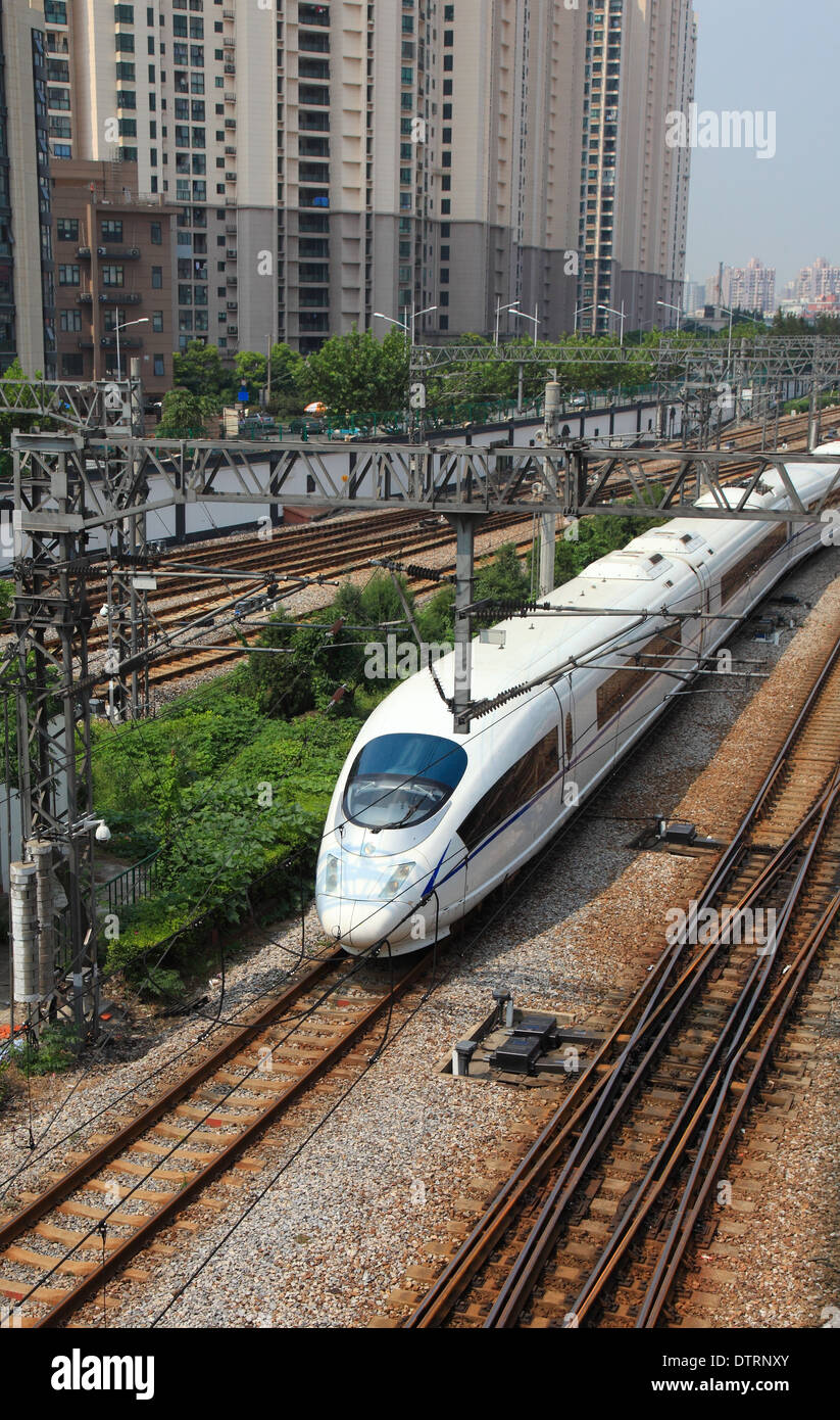 Train on rail road tracks on a sunny day Stock Photo