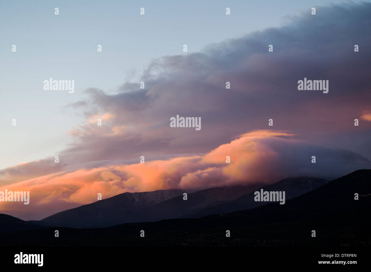 Pink and red sunset clouds over Salida, Colorado, USA Stock Photo