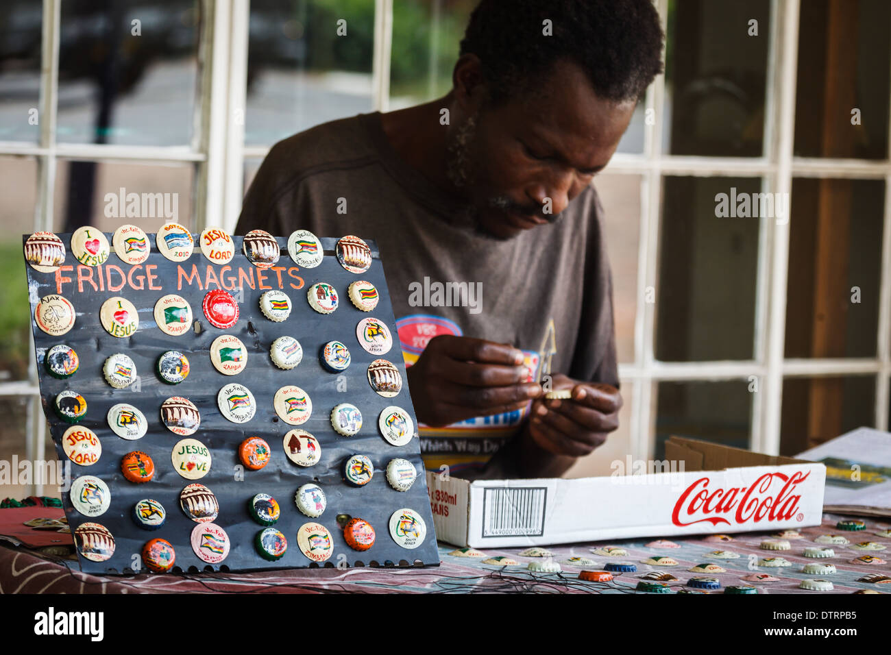 Zimbabwe artist paints refrigerator made from bottle caps to