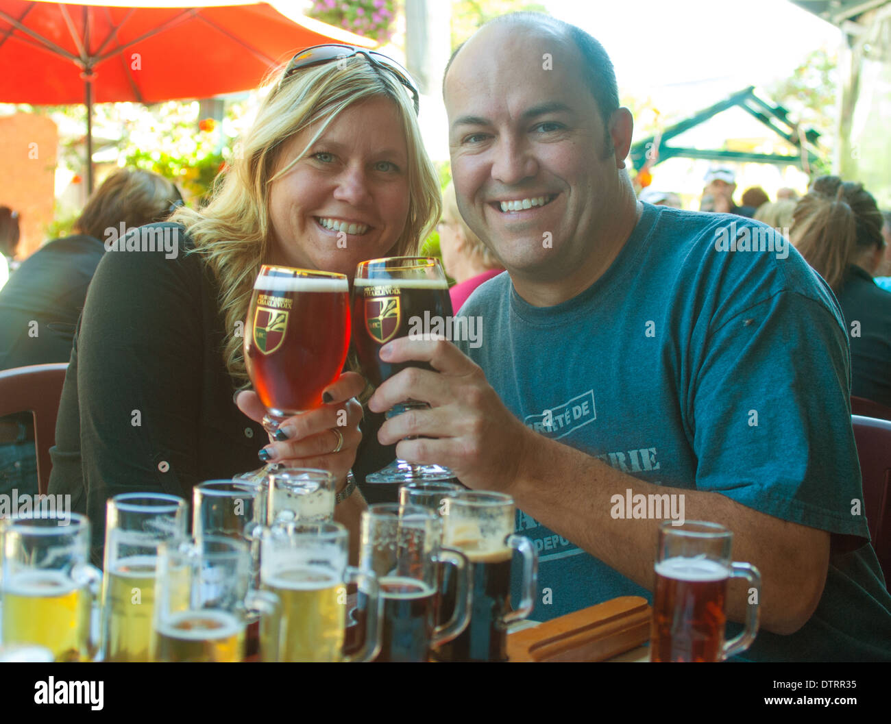 couple toasting with beer glasses canada Stock Photo Alamy