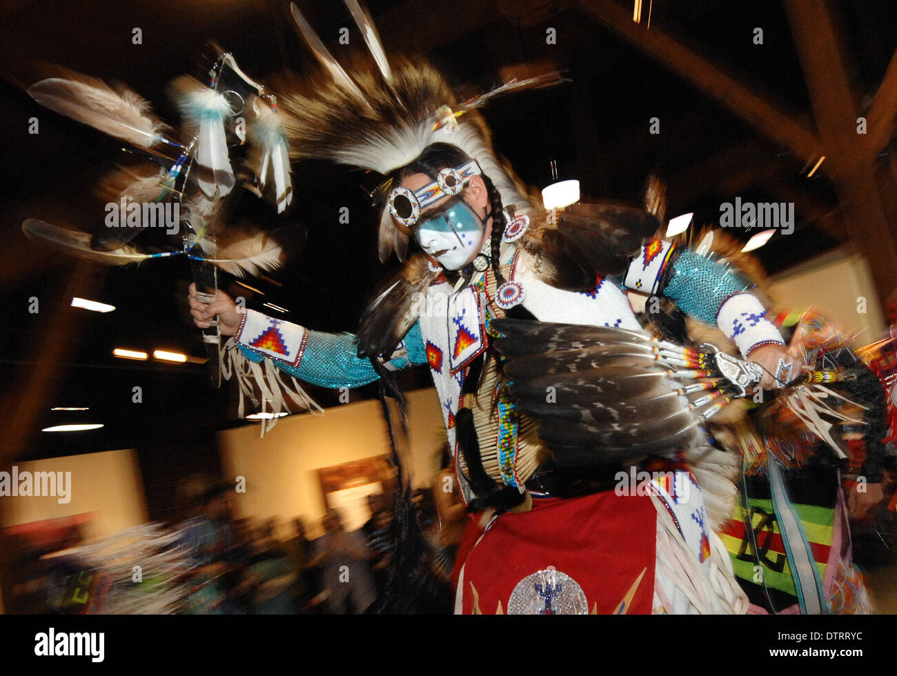 Vancouver, Canada. 23rd Feb, 2014. William White Buffalo of Cree Nation dances at the Native Indian Pow Wow as part of the annual Talking Stick Aboriginal Arts Festival in Vancouver, Canada, on Feb. 23, 2014. The Talking Stick Festival is a two-week celebration, aimed at preserving and promoting the language, culture and art forms of the First Nations people by developing and presenting aboriginal traditions of music, dance and storytelling in a contemporary and entertaining way. Credit:  Sergei Bachlakov/Xinhua/Alamy Live News Stock Photo