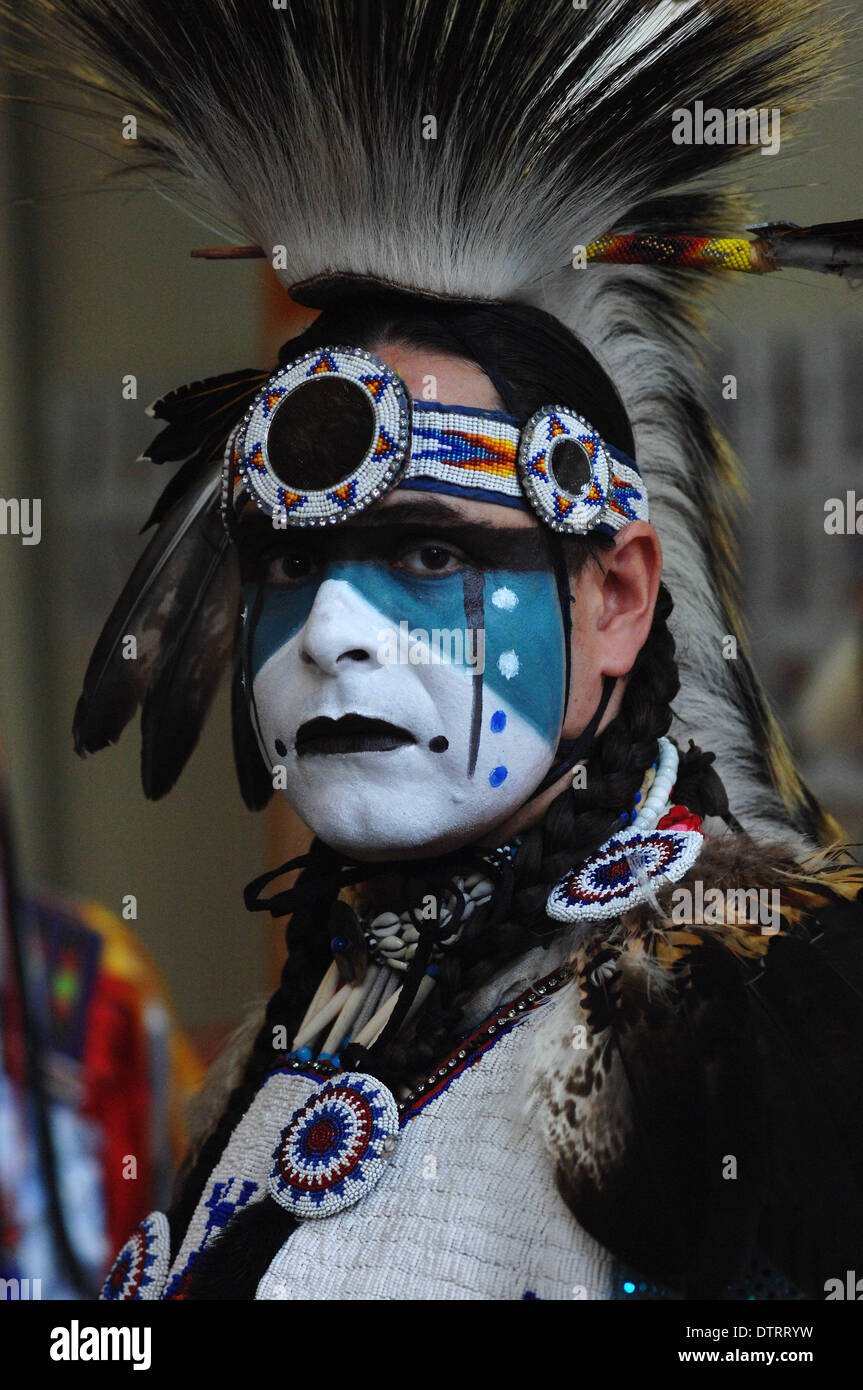 Vancouver, Canada. 23rd Feb, 2014. William White Buffalo of Cree Nation poses during the Native Indian Pow Wow as part of the annual Talking Stick Aboriginal Arts Festival in Vancouver, Canada, on Feb. 23, 2014. The Talking Stick Festival is a two-week celebration, aimed at preserving and promoting the language, culture and art forms of the First Nations people by developing and presenting aboriginal traditions of music, dance and storytelling in a contemporary and entertaining way. Credit:  Sergei Bachlakov/Xinhua/Alamy Live News Stock Photo