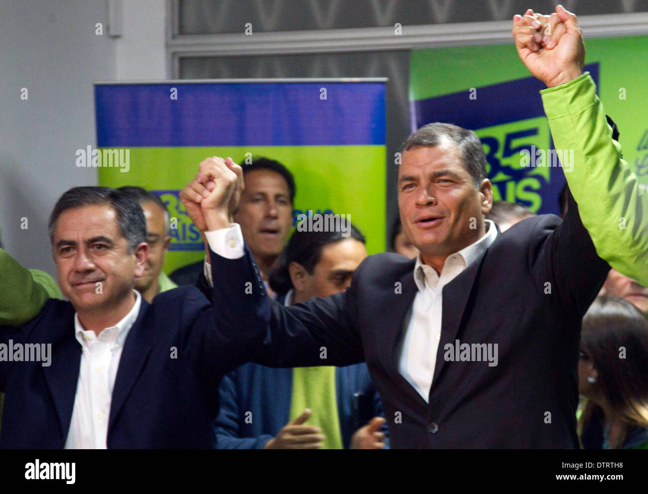 Quito, Ecuador. 23rd Feb, 2014. Ecuador's President Rafael Correa (R) and the candidate for the reelection to the Quito's Mayoralty, Augusto Barrera (L), react after receiving the results of the provincial and municipal election, at the headquarters of the Pais Alliance party, in the city of Quito, capital of Ecuador, on Feb. 23, 2014. The opposition candidate Mauricio Rodas won the election for the Quito's Mayoralty, according to local press. Credit:  Santiago Armas/Xinhua/Alamy Live News Stock Photo