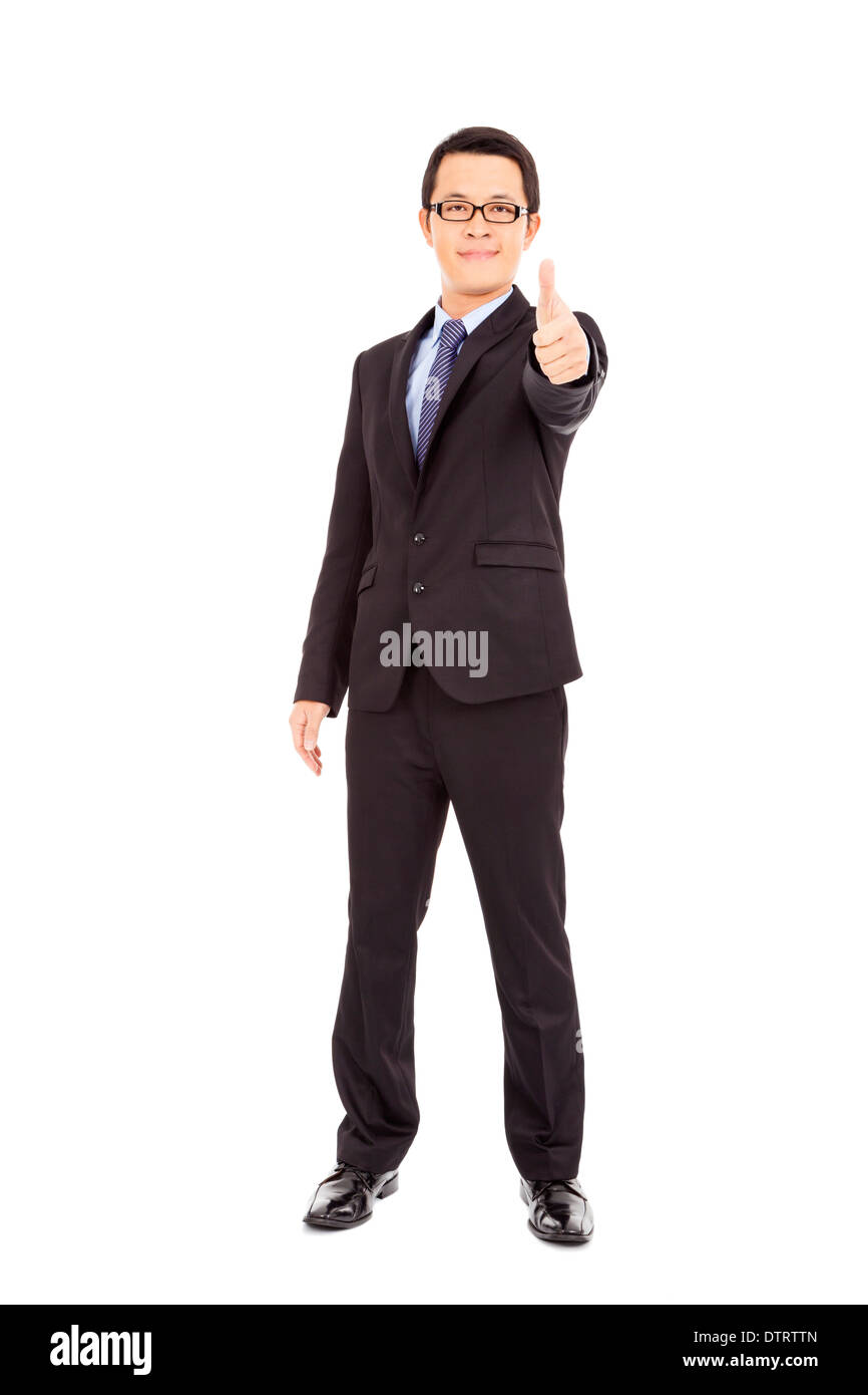 Confident businessman standing arms thumb up in studio Stock Photo