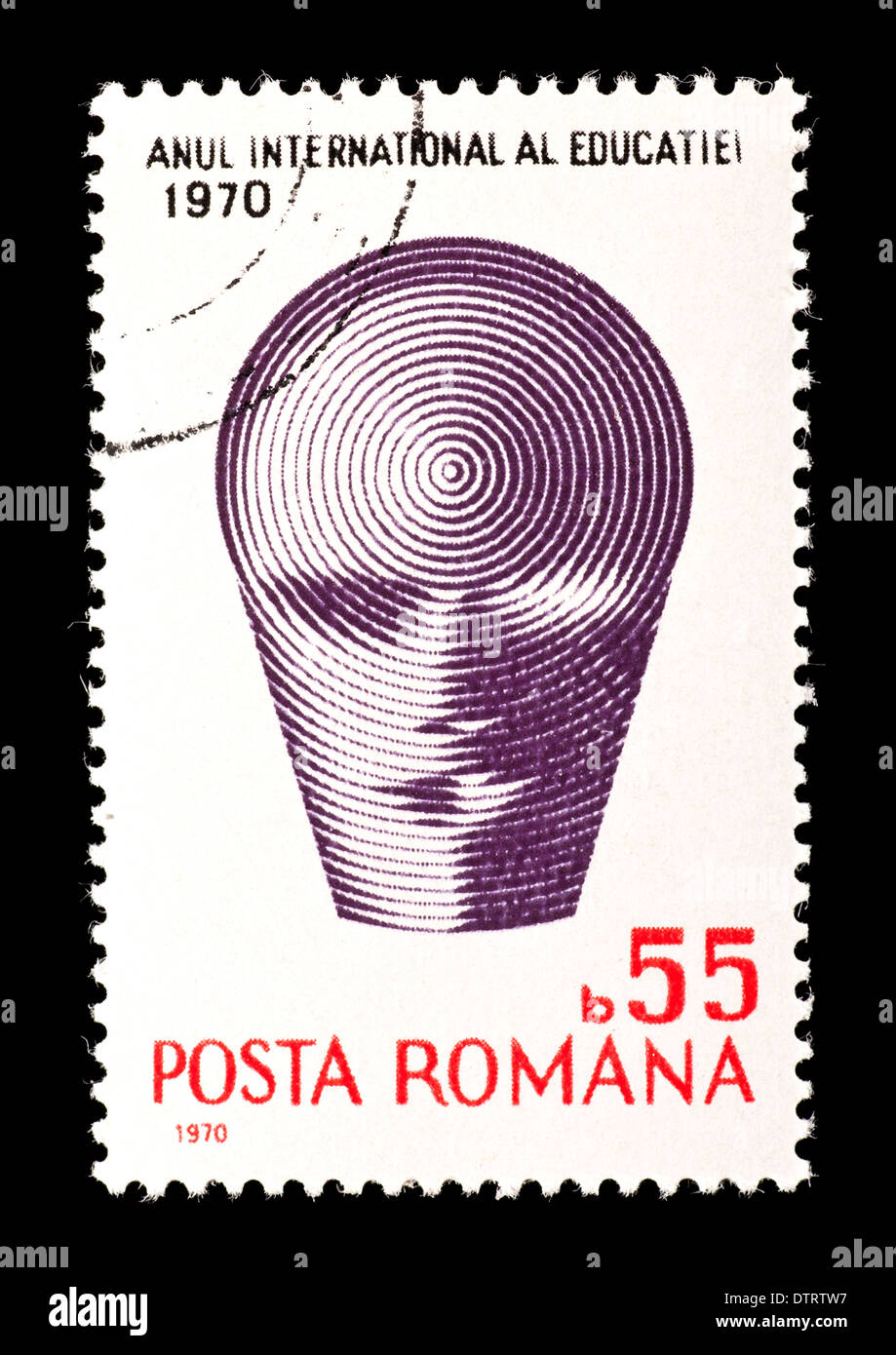 Postage stamp from Romania depicting a stylized human face, issued for the international education year (1970) Stock Photo