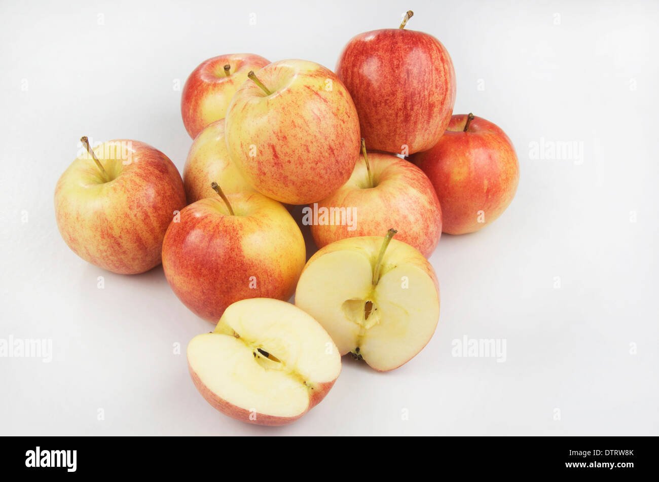 Apples on white background with one cut open Stock Photo